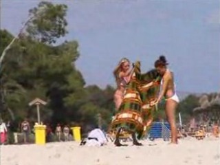 2 topless lesbian girls on the beach