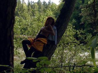 adventurous babe enjoying her masturbation on a tree